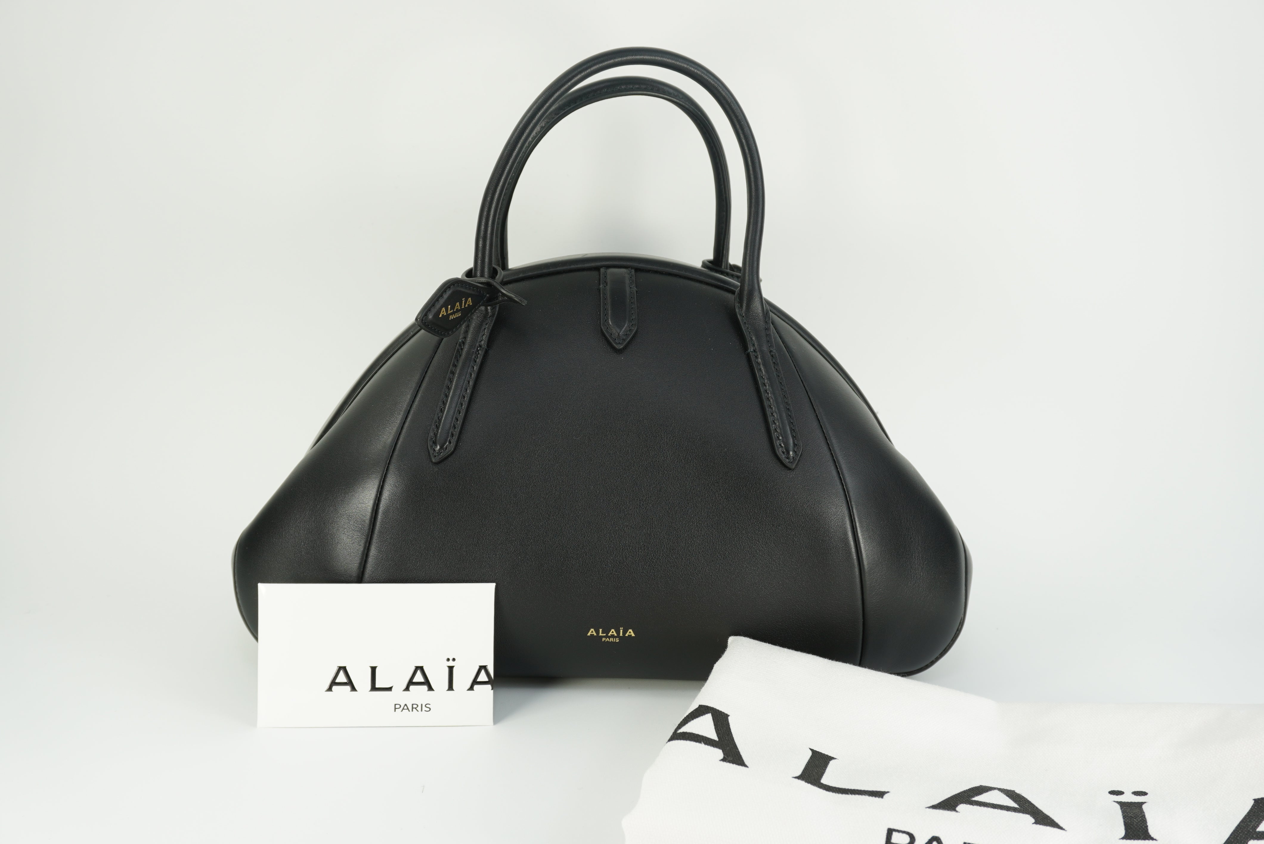 ALAÏA Purse Top handle bag in calfskin