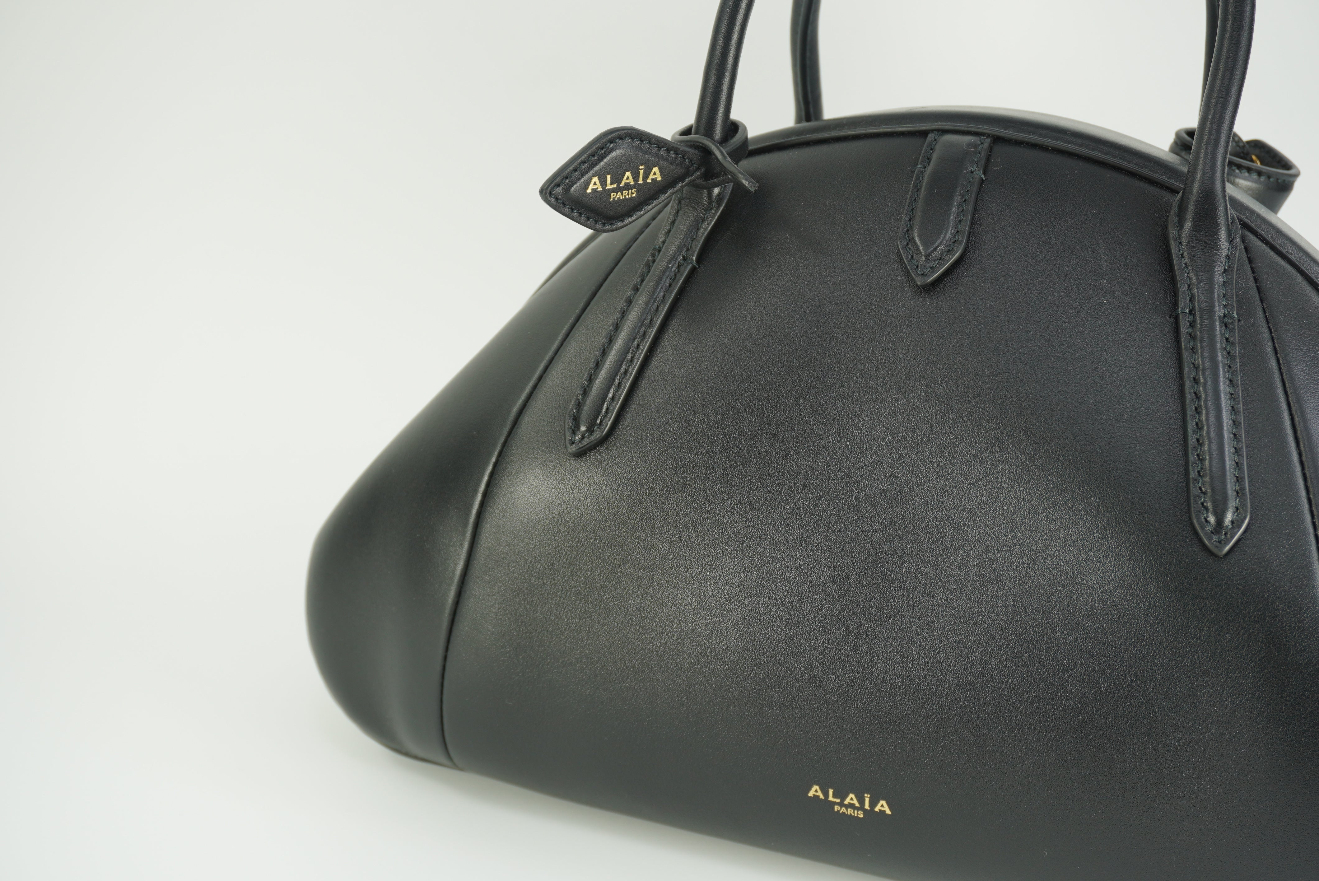 ALAÏA Purse Top handle bag in calfskin